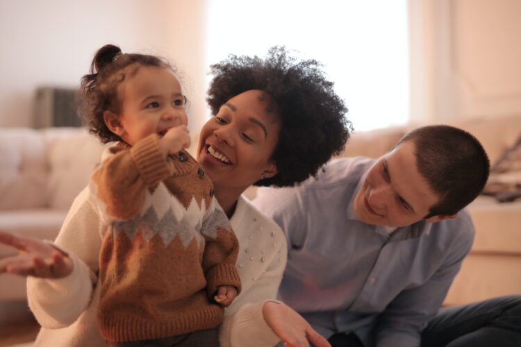 Two adults with young child